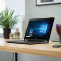 A Dell Latitude E5250 i5 5200U 2.2GHz 8GB 500GB NO OS 12.5" laptop sits open on a wooden desk, surrounded by a plant, pencil holder, and office supplies. Brand: Dell. Includes 3-month warranty.